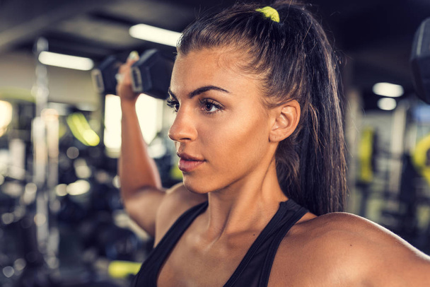 Young woman workout in gym healthy lifestyle - Foto, Imagem