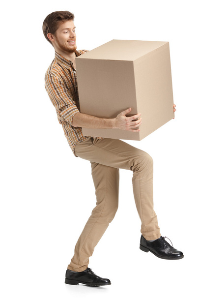 Deliveryman hardly carries the box - Photo, Image