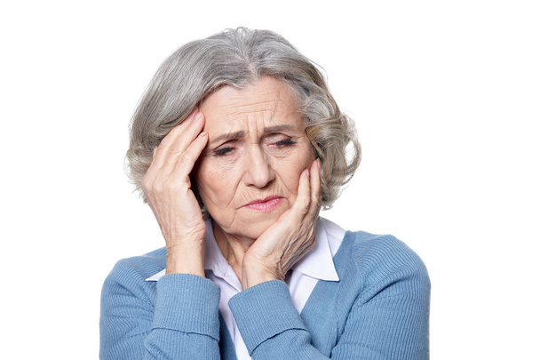 Sad senior woman with headache isolated on white background - Foto, immagini