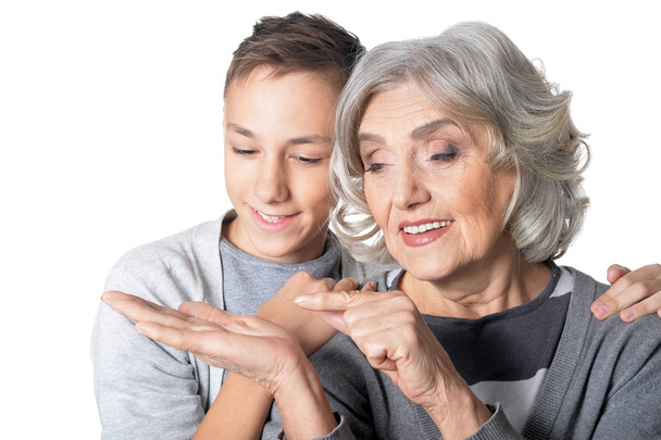 Grandmother showing something to grandson - Foto, afbeelding