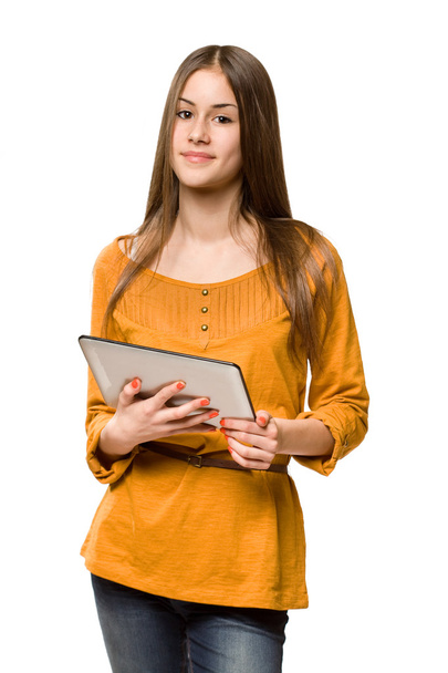Teen girl using tablet computer. - Foto, afbeelding