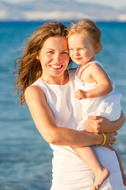 Mother and daughter on the beach - Photo, Image
