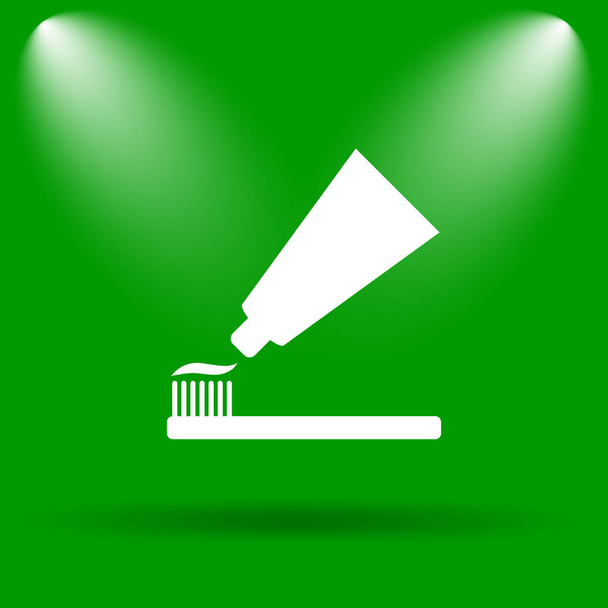Tooth paste and brush icon. Internet button on green background - Photo, Image