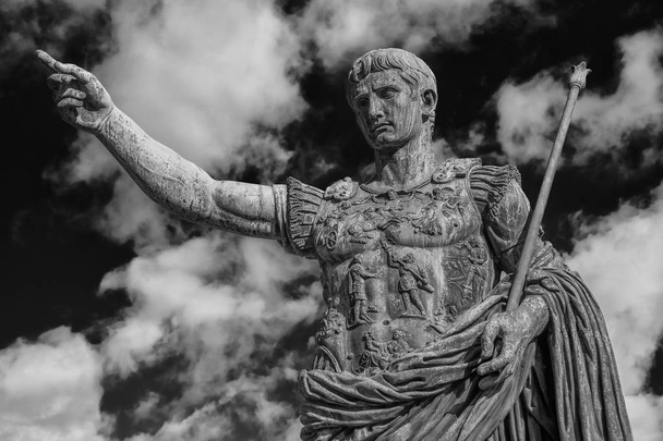 Caesar Augustus, the first emperor of Ancient Rome. Bronze monumental statue in the center of Rome, with clouds (Black and White) - Photo, Image