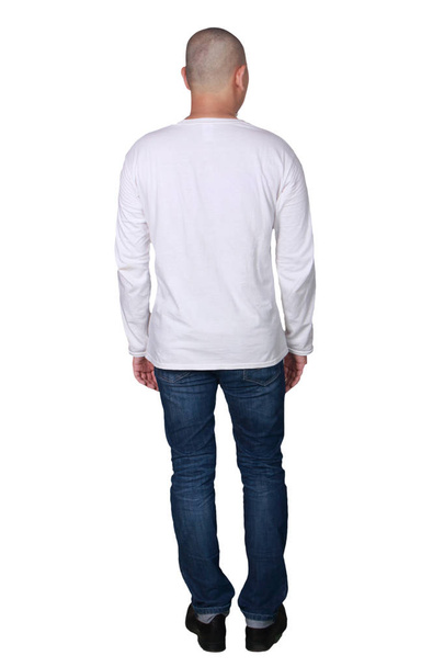 Man standing posing wearing plain white long sleeved shirt, blank t-shirt mock up for printing, full body portrait rear view - Foto, Bild
