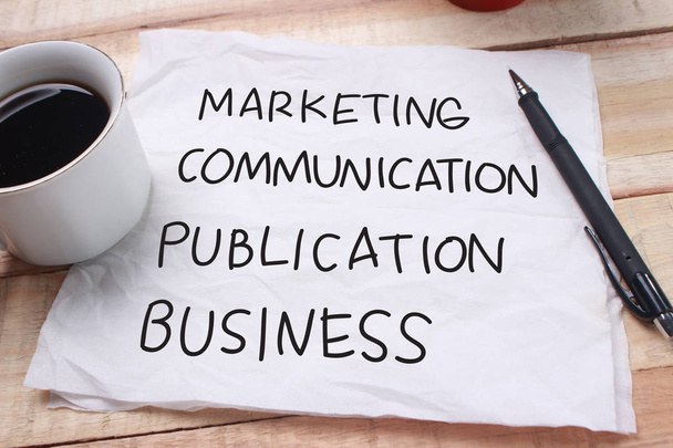 Маркетинговая коммуникация Публикация Бизнес-слова письмо, написанное на бумаге памятка, рабочий стол вид сверху. Концепция мотивационных типографических цитат
  - Фото, изображение