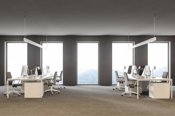 Side view of modern grey office interior with rows of white computer desks and loft windows. International company concept 3d rendering copy space - Foto, Imagen
