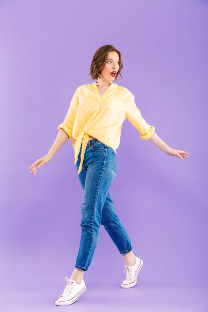 Photo of amazing excited woman posing isolated over purple wall background. - Foto, afbeelding