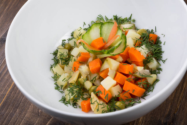 Mixed vegetables salad served in a white bowl - Valokuva, kuva