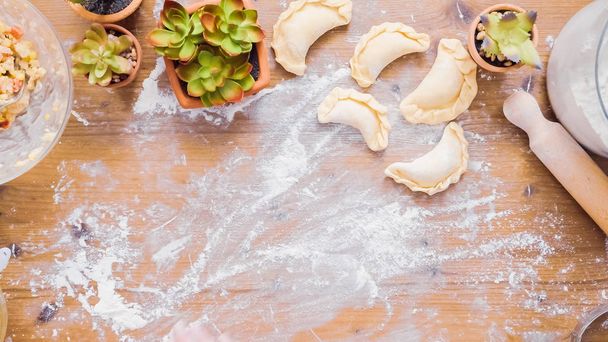 Step by step. Rolling dough for home made empanadas. - Zdjęcie, obraz