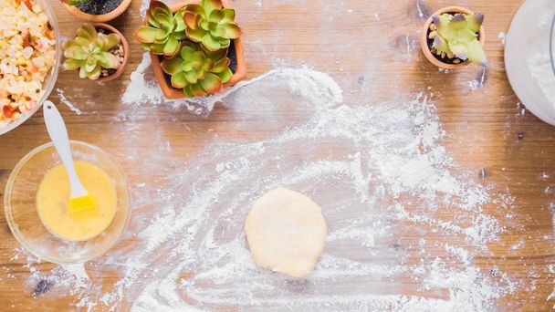 Step by step. Rolling dough for home made empanadas. - Zdjęcie, obraz
