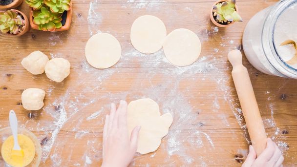 Step by step. Rolling dough for home made empanadas. - Foto, Imagen