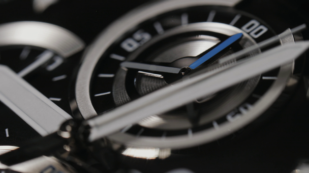Macro shot of watch with second hand passing. Clock face rack focus. Modern mens wristwatch with second hand. 4k - Footage, Video