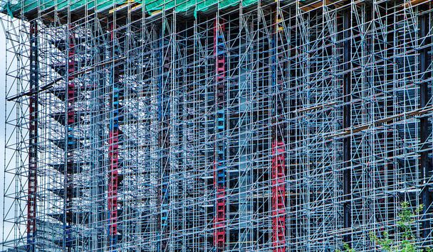 Construction of a high-rise building. Constructions. Abstract Scaffold Texture Background. Architecture. - Photo, Image