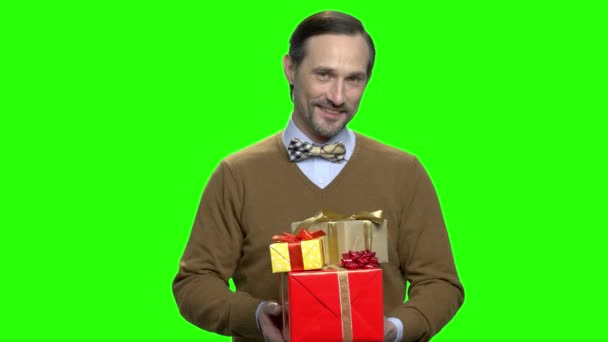 Handsome pleasant man giving present boxes to you. - Footage, Video
