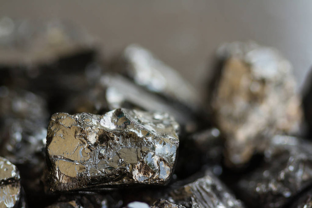 Black coal mine close-up with soft focus. Anthracite coal bar on dark background - 写真・画像