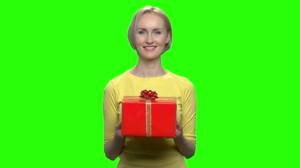 Beautiful adorable woman holding red gift box. - Footage, Video
