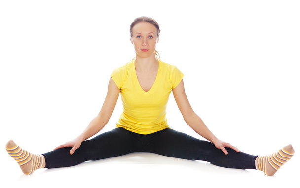 Young woman doing yoga exercise - Photo, image