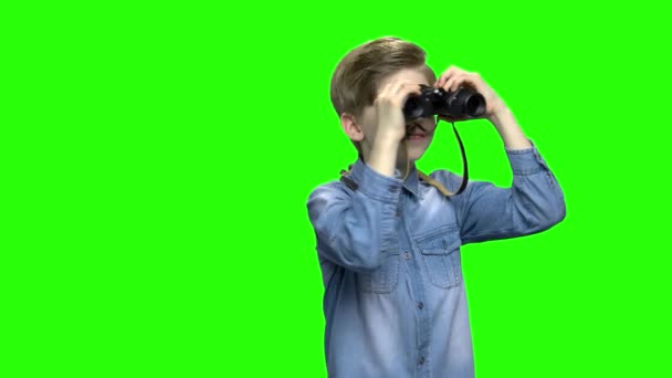 Child boy tourist looking through binoculars. - Footage, Video