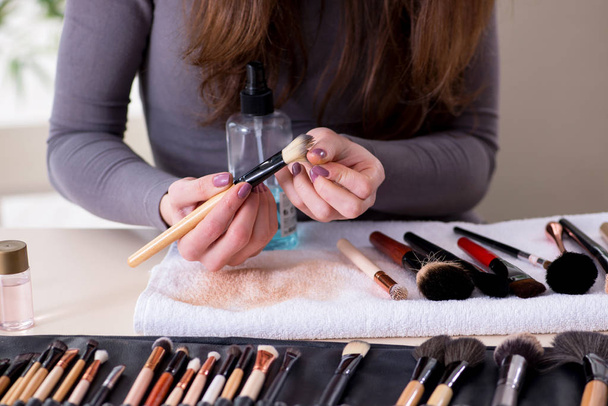 Make-up artist preparing brushes for work - Фото, зображення