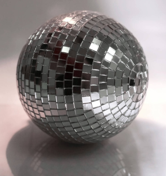 mirror ball.isolated on a dark background in the photo with copy space - 写真・画像