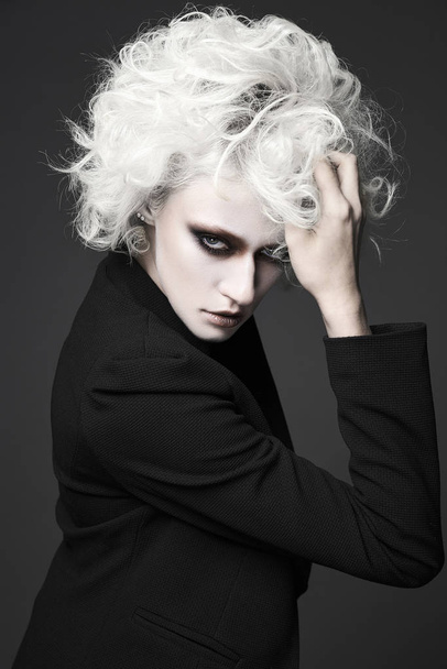 fashion close-up portrait of halloween make-up woman with white skin and hair.clown woman - 写真・画像