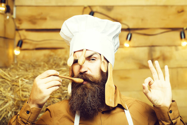 Chef cook with wooden spoons - Photo, Image