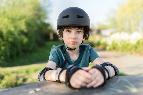 Portrait of a boy in a protective helmet. - Фото, изображение