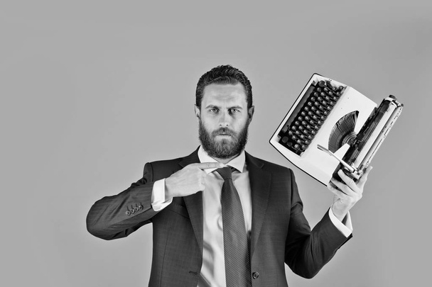 business man in blue suit and tie with typewriter - Фото, изображение