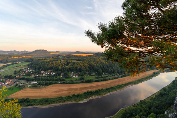 Landscapes of Saxon Switzerland - is the German part of Elbe Sandstone Mountains. Sunset over the valley of the river Elbe. - Фото, зображення