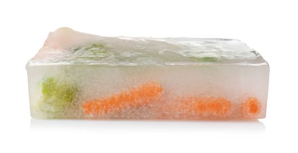 Fresh vegetables frozen in ice cube on white background - Fotografie, Obrázek