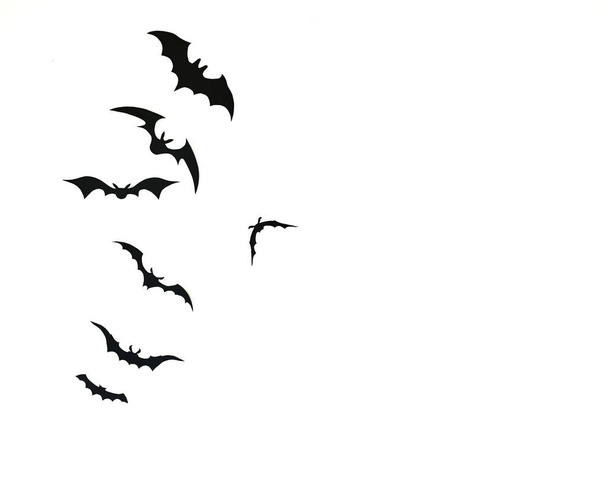 Bat paper decoration halloween and scary concept, black paper bats flying over white background - Photo, Image