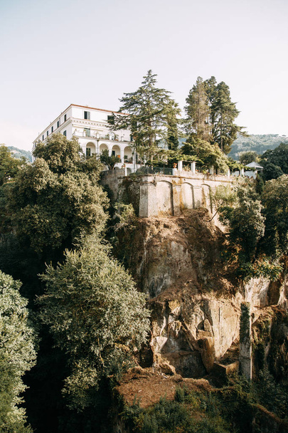 Views of the city of Sorrento in Italy, panorama and top view. Night and day, the streets and the coast. Beautiful landscape and brick roofs. Architecture and monuments of antiquity. Shops and streets with fountains and sculptures. - Photo, Image