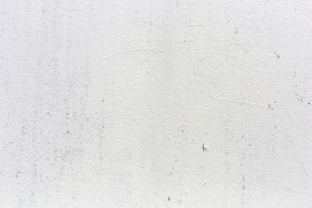 Wit geschilderde muur voor gebruik als achtergrond. - Foto, afbeelding
