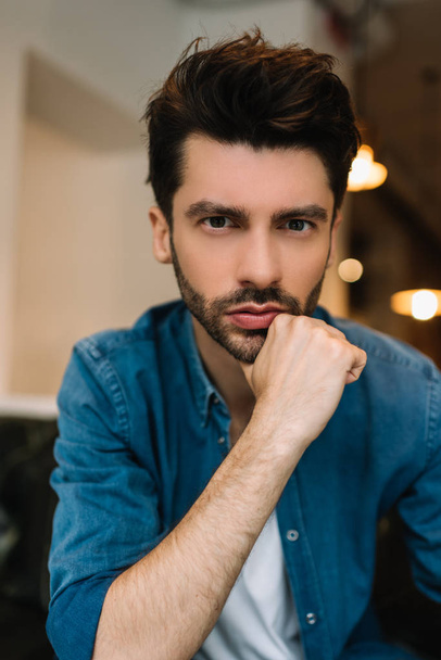 Portrait of handsome bearded man with stylish hairstyle wearing trendy casual clothes posing for pictures - Valokuva, kuva