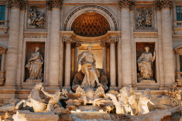 The Trevi fountain in Rome, a beautiful sight. Ancient architecture and sculpture. Art on the street, the most beautiful fountain in Europe. Miracle of light - Photo, Image