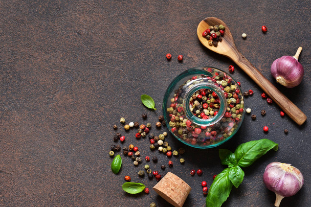 Food frame. Food background - spices: pepper, garlic, basil. Ingredients for marinade. - Photo, Image