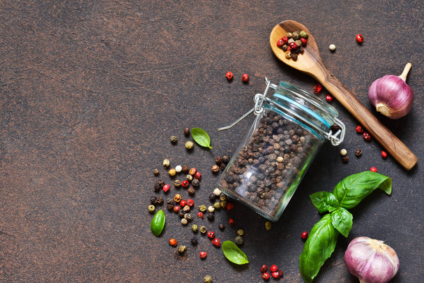 Food frame. Food background - spices: pepper, garlic, basil. Ingredients for marinade. - Фото, изображение
