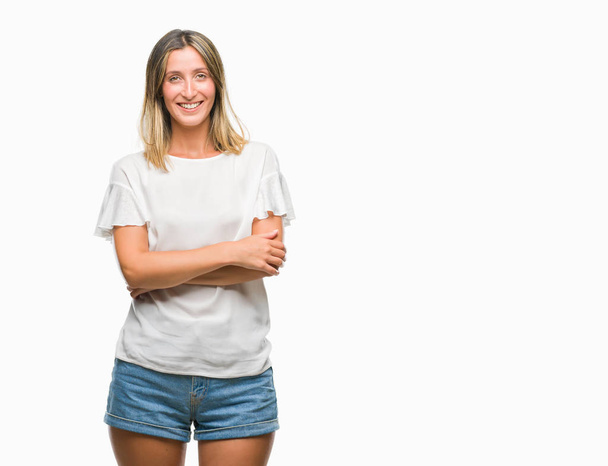 Young beautiful woman over isolated background happy face smiling with crossed arms looking at the camera. Positive person. - Photo, Image