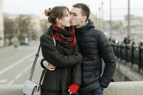 young love couple in winter city street  - Φωτογραφία, εικόνα