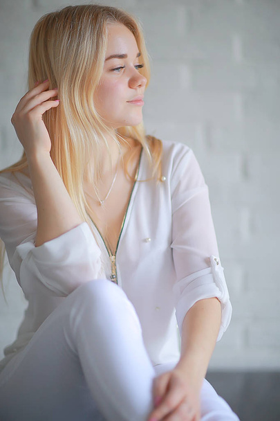 beauty portrait of cute blonde young woman in white clothes - Φωτογραφία, εικόνα