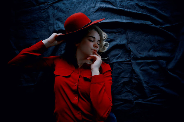 attractive young blonde woman wearing red clothes and red hat   - Φωτογραφία, εικόνα