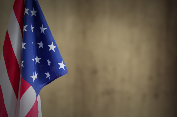 American flag in front of brown background. Copy space - Photo, Image