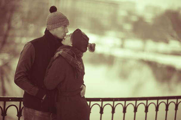 young man and woman walking in autumn city, romantic happy couple  - Fotó, kép