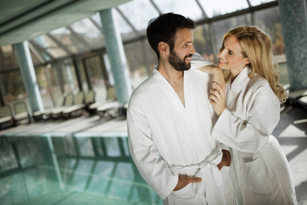Portrait of attractive cheerful couple in spa center - Foto, Bild