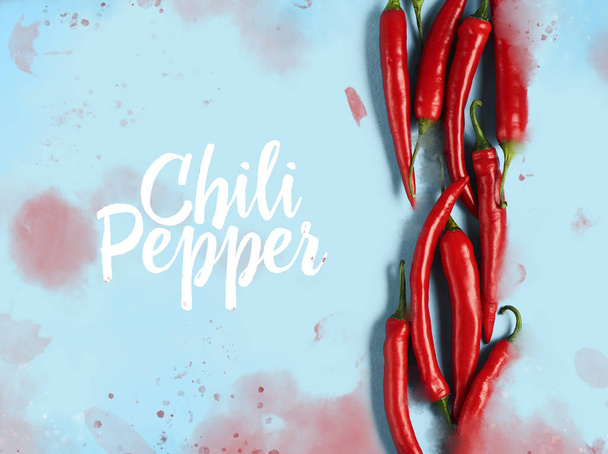 Flat lay red chili peppers pattern on blue background. Top view - Фото, зображення
