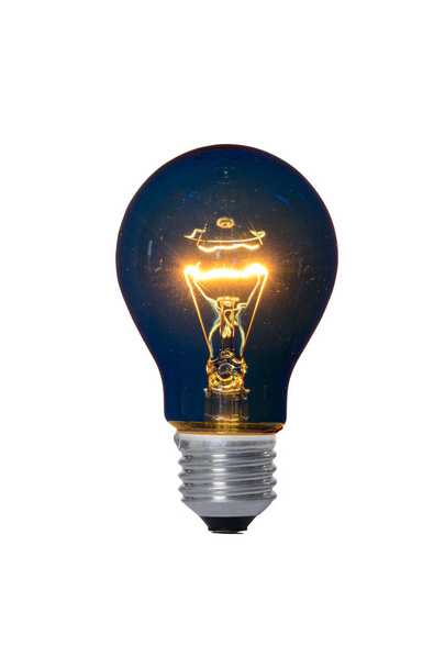 Hehkulamppu lasi lamppu ja E27 Euroopan sininen kiinnitys lukemiseen. Vanha kulutustaso vanhentunut ja kielletty nykyisillä säännöksillä
. - Valokuva, kuva