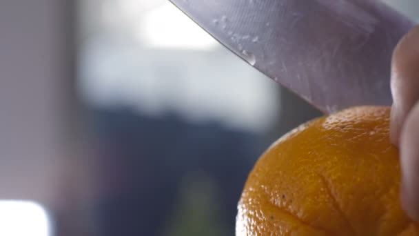 Cutting fresh spraying orange - Footage, Video