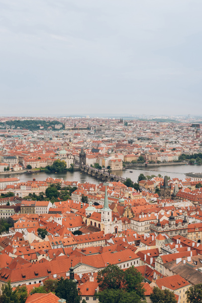 aerial view of beautiful prague cityscape with famous Charles Bridge and Vltava river - Photo, Image