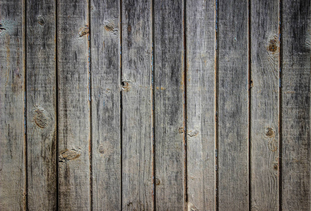 Las tablas verticales de la pared de madera / la mesa con los restos viejos de la pintura sobre ellos
 - Foto, imagen